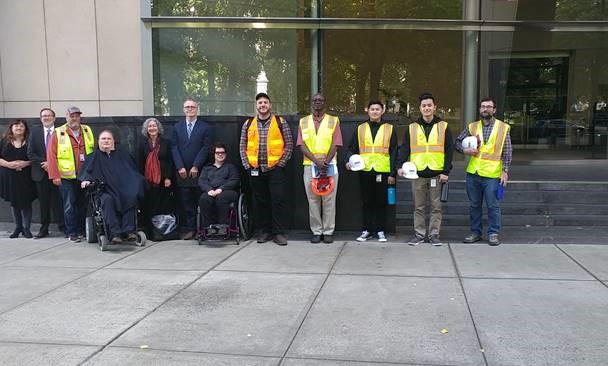 Photo of attorneys, class members, and city of Portland celebrating approval of the building of more accessible curb ramps.